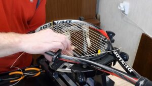 Stringer for tennis rackets